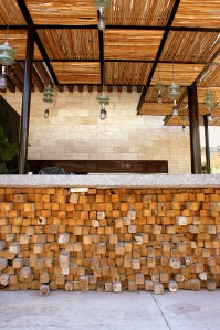 A bar made from reclaimed wood and lights made from reclaimed glass.(Photo/Kendra Yost)